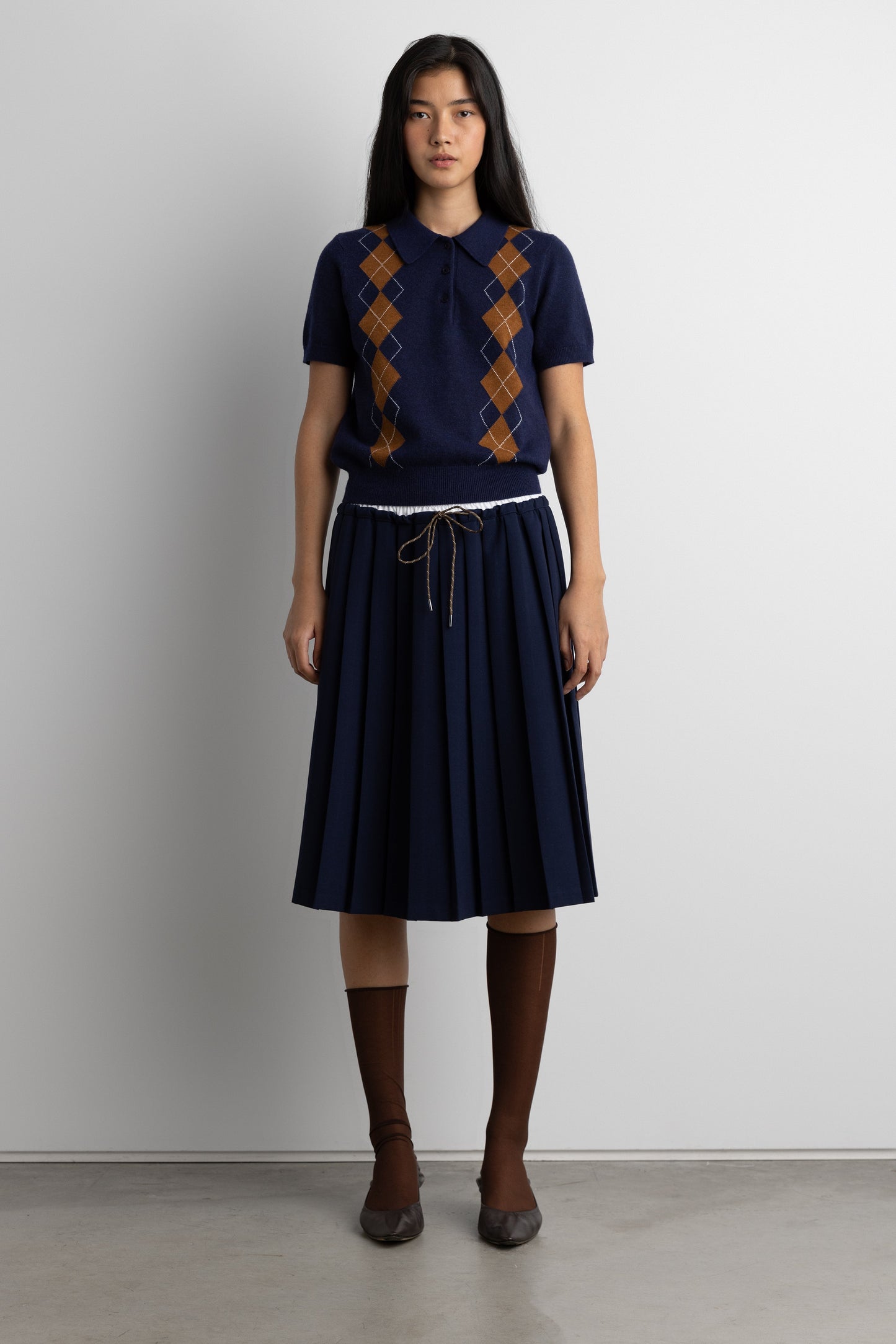 EXPOSED WAIST PLEATED MIDI SKIRT