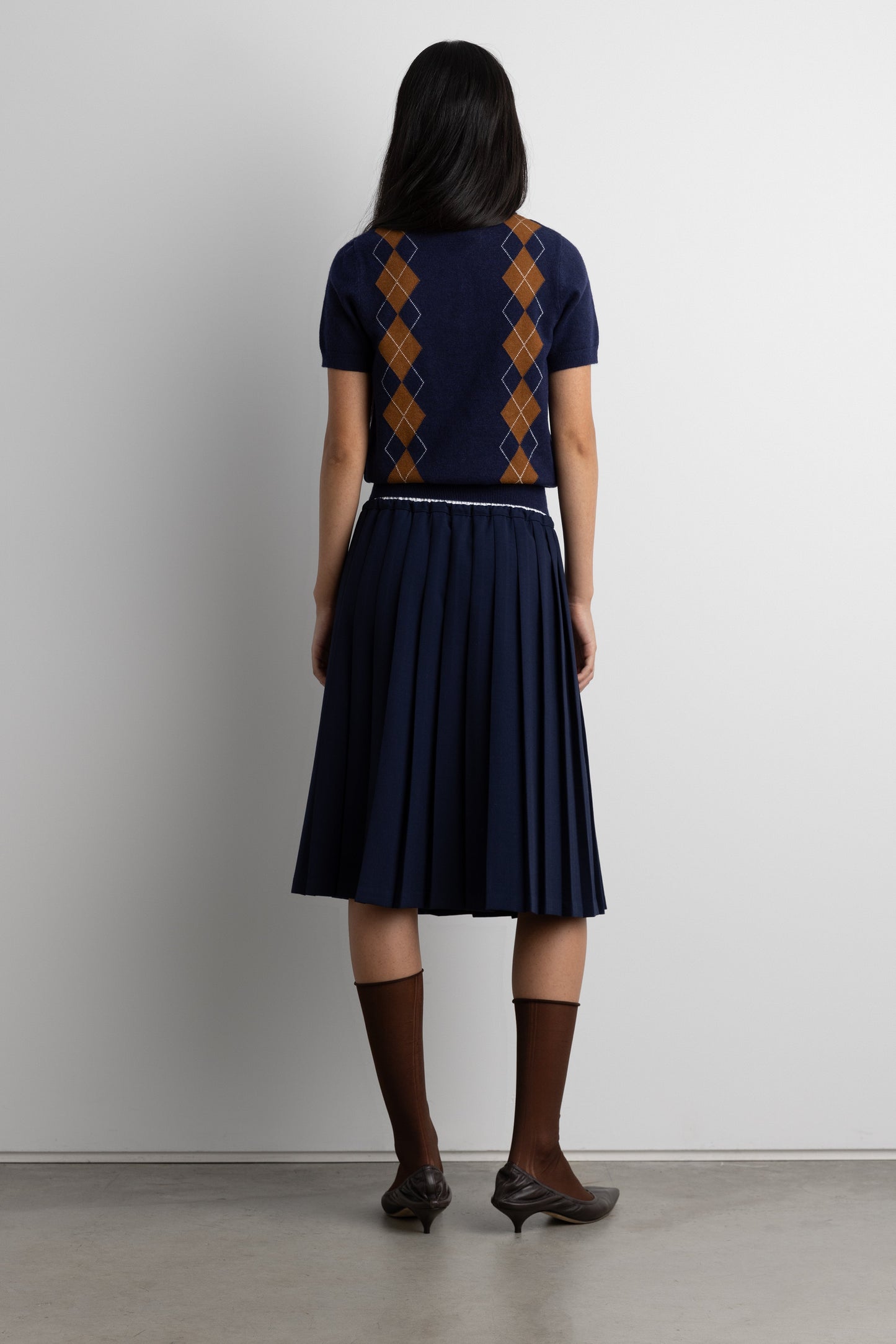 EXPOSED WAIST PLEATED MIDI SKIRT
