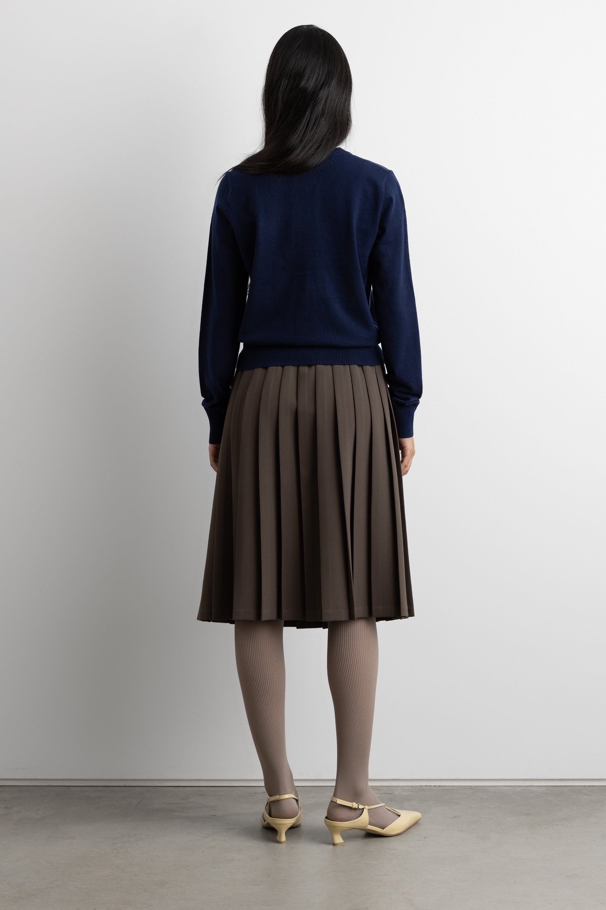 EXPOSED WAIST PLEATED MIDI SKIRT