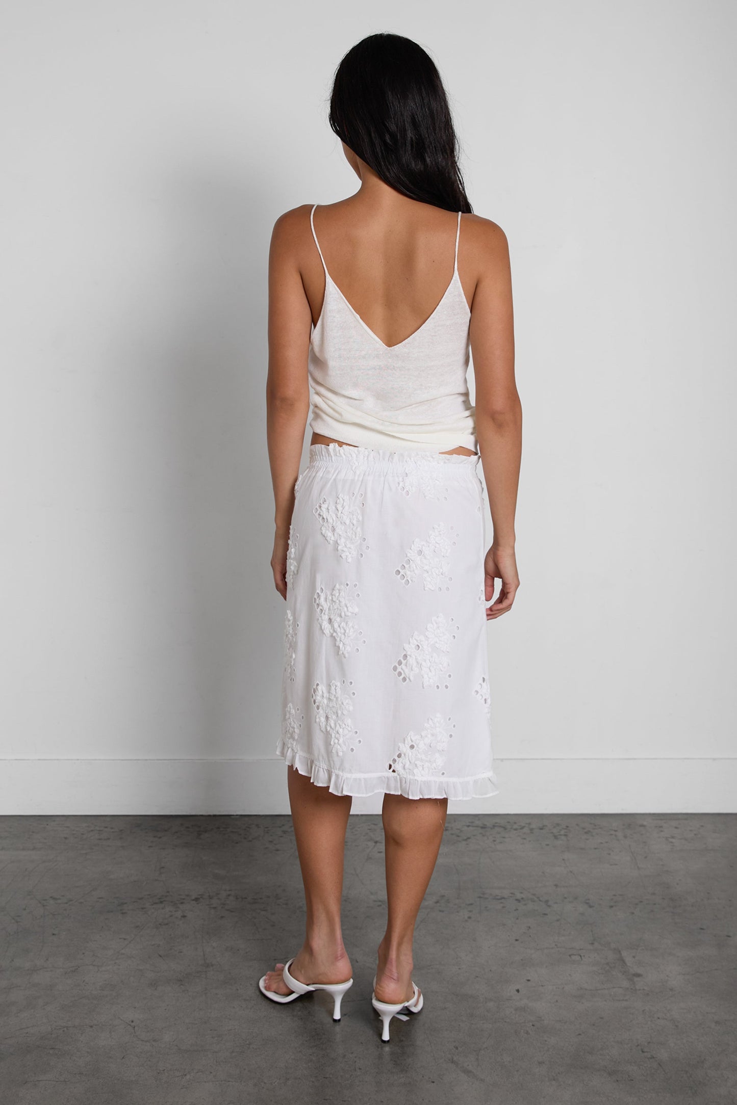 EYELET FRILLED HEM MINI SKIRT