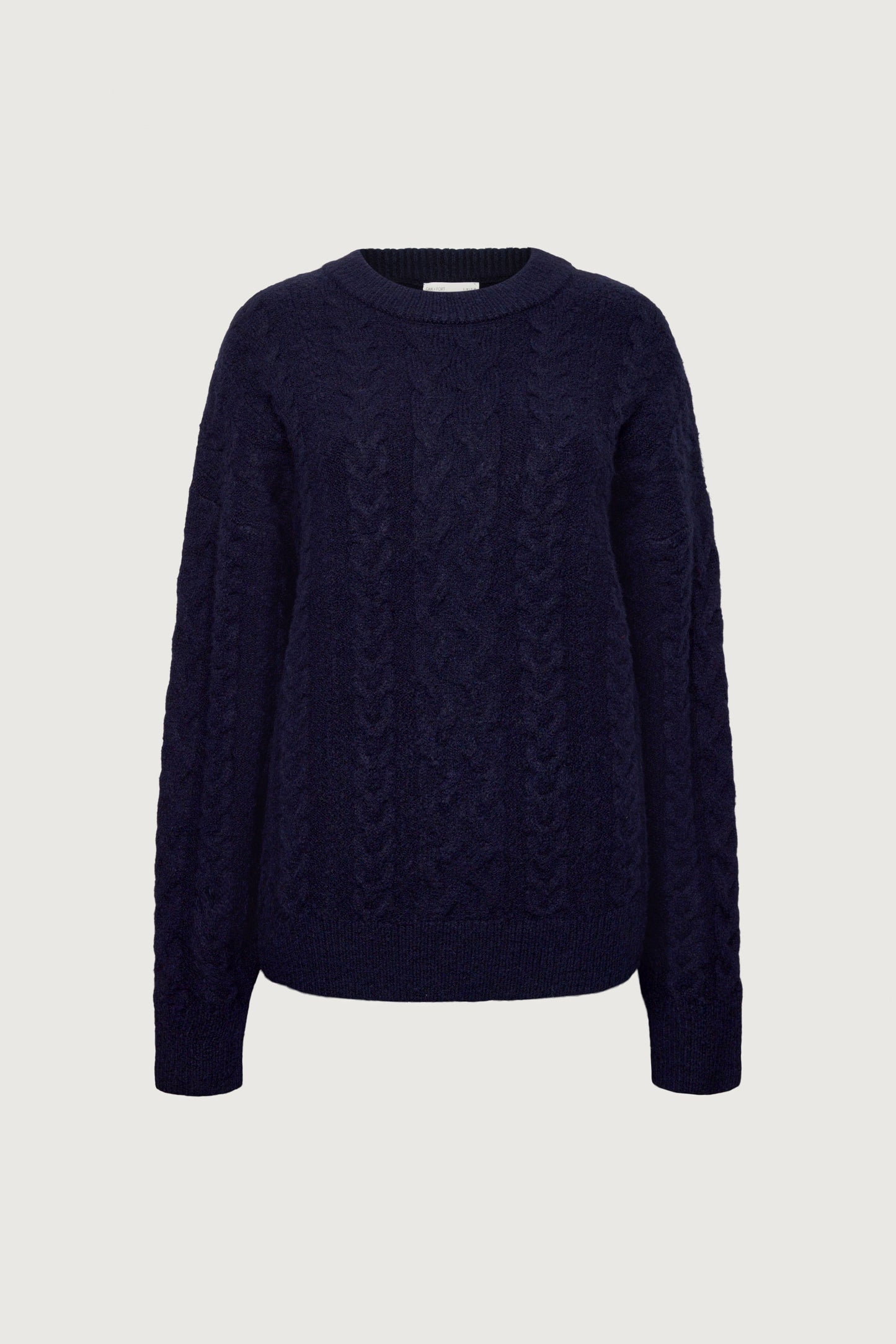 OVERSIZED CABLE KNIT SWEATER