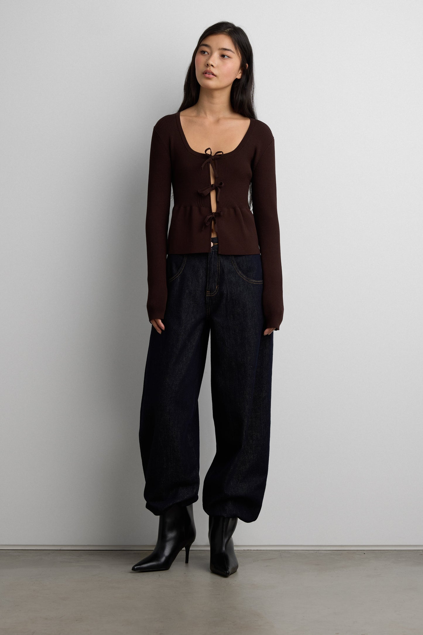 RIBBED TIE FRONT PEPLUM SWEATER