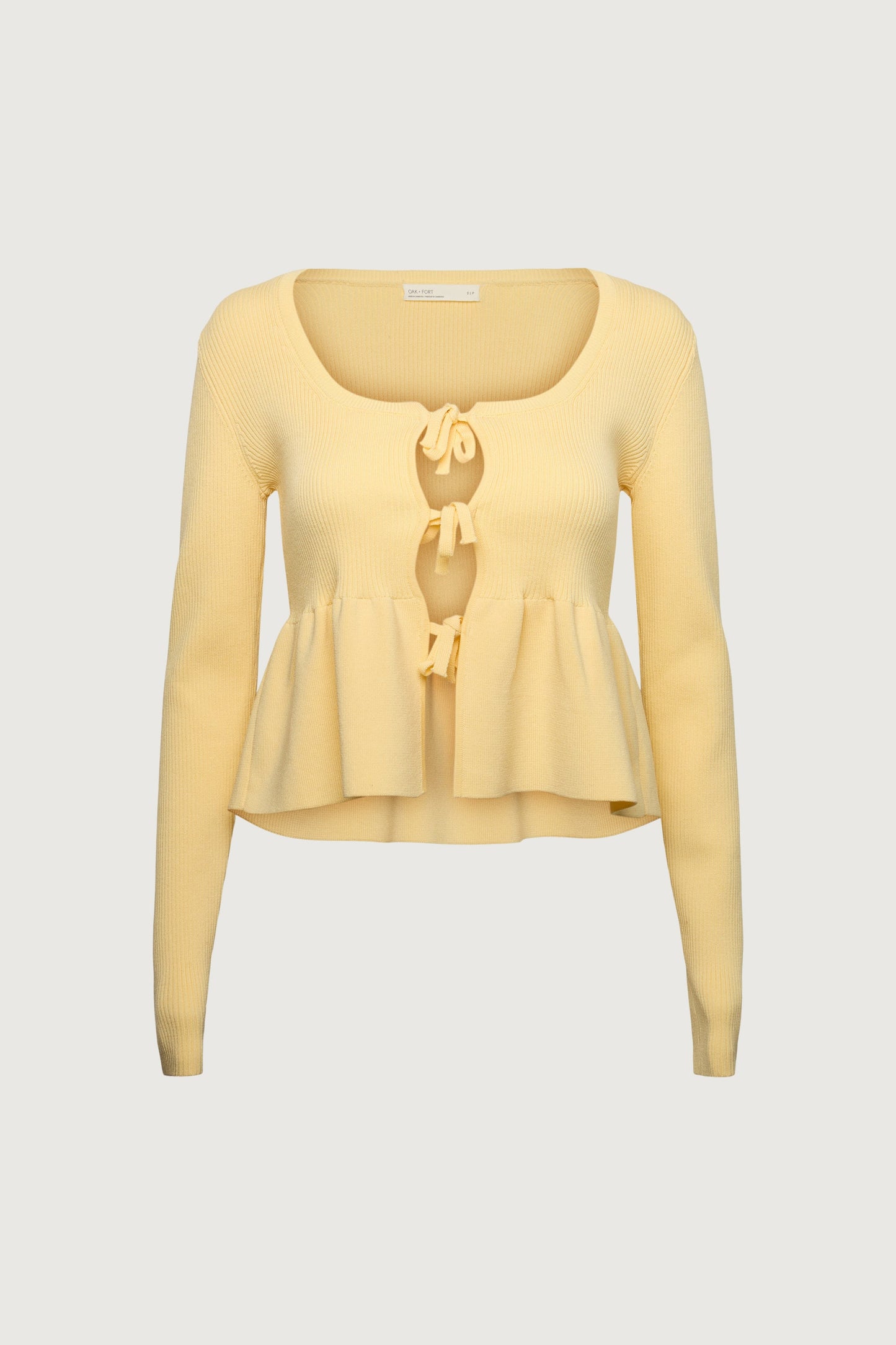 RIBBED TIE FRONT PEPLUM SWEATER