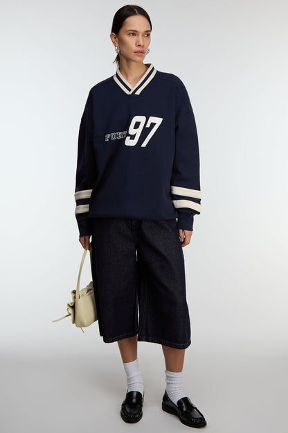 V-NECK VARSITY GRAPHIC SWEATSHIRT